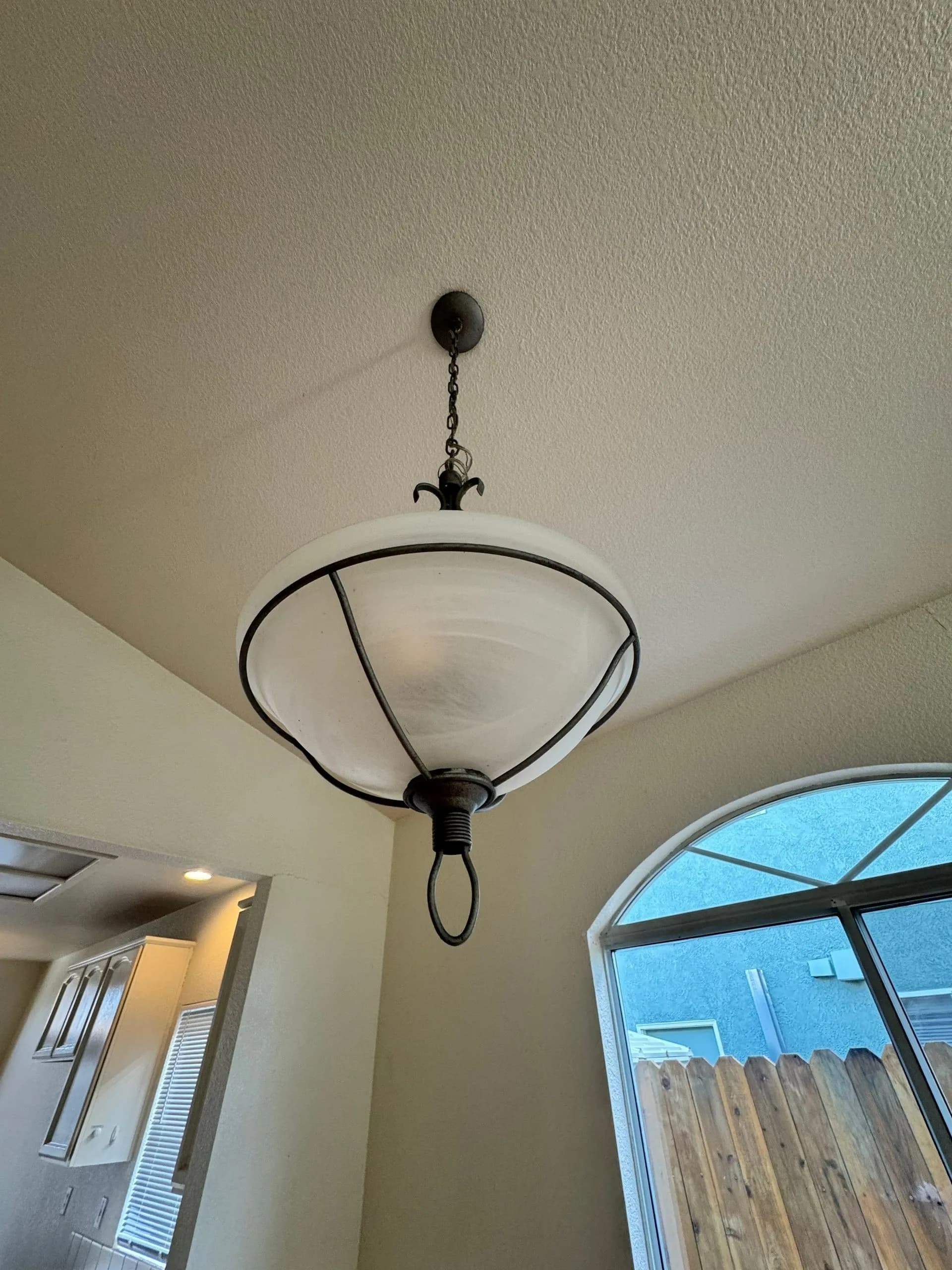 Clean ceiling light fixture in a residential home