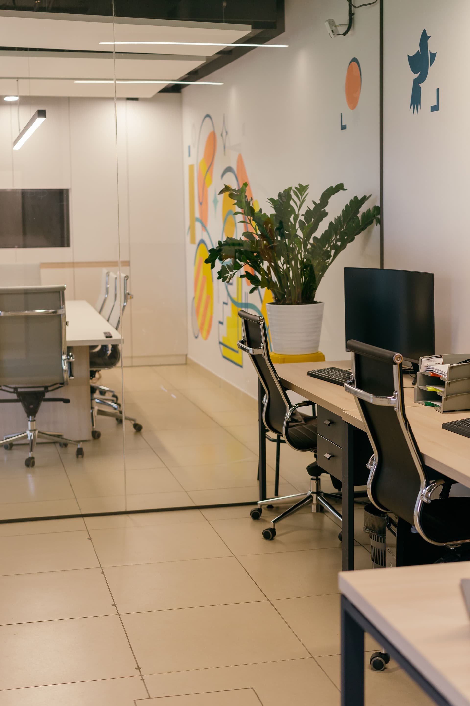 Modern open-plan office with colourful wall graphics