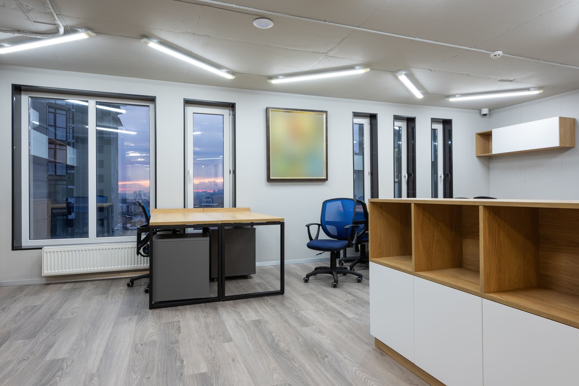 Contemporary office interior with wood flooring