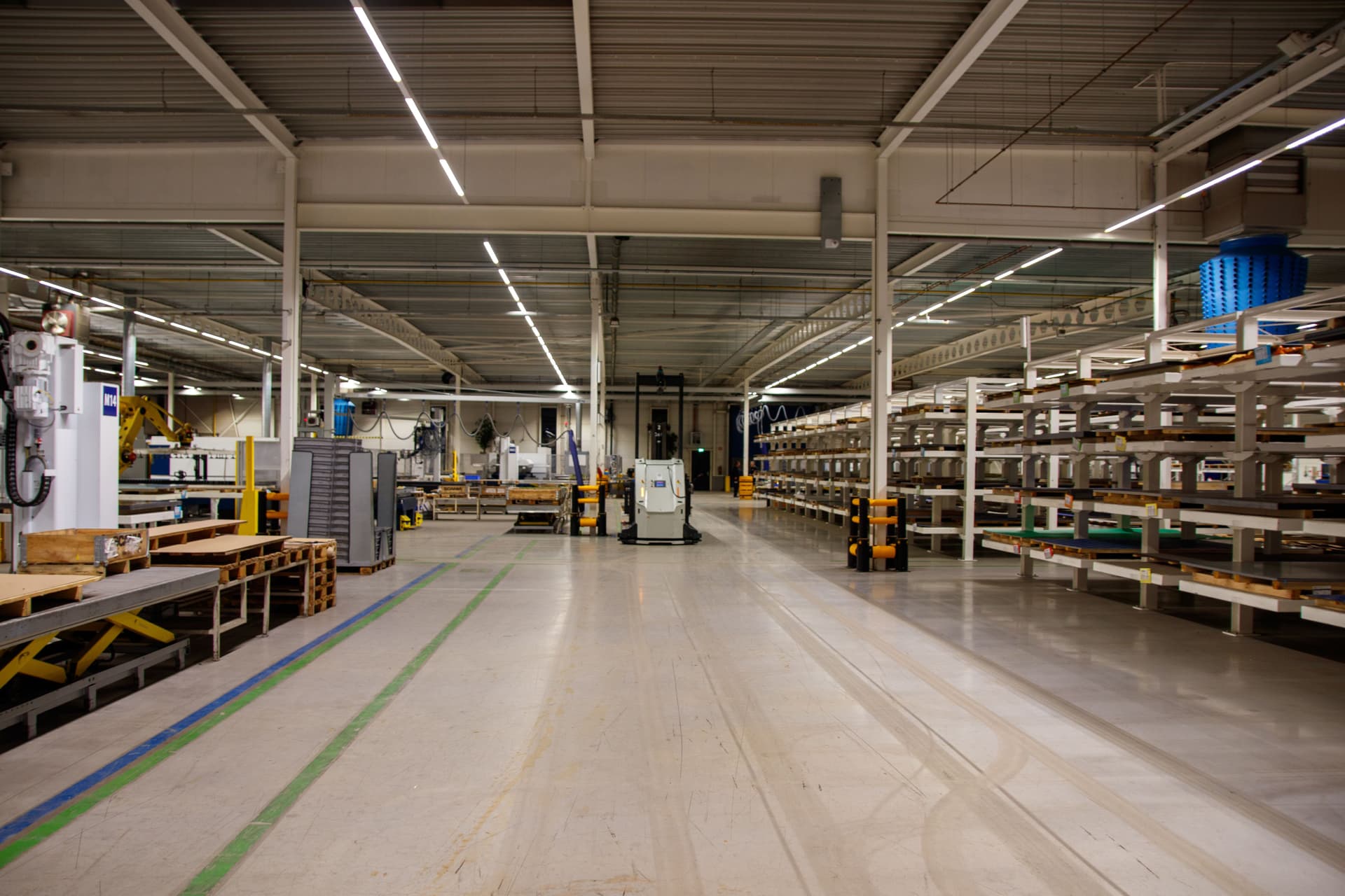 Clean factory aisle — industrial cleaning by Shai & Fortuna